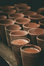 brown clay pots on brown wooden table